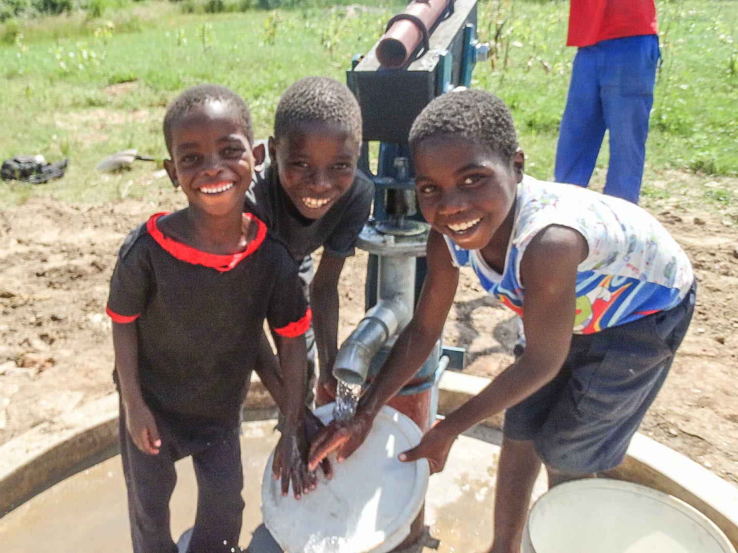Children Gathering Water from New Borehole