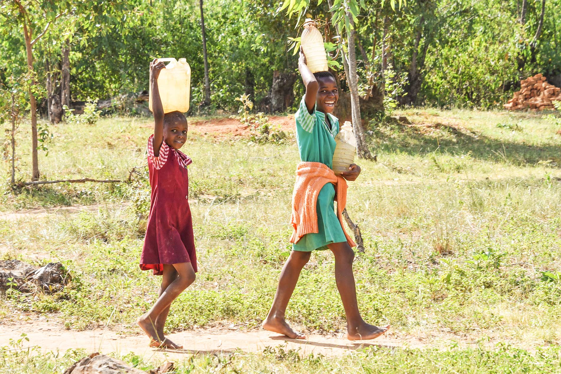 Girls carrying water